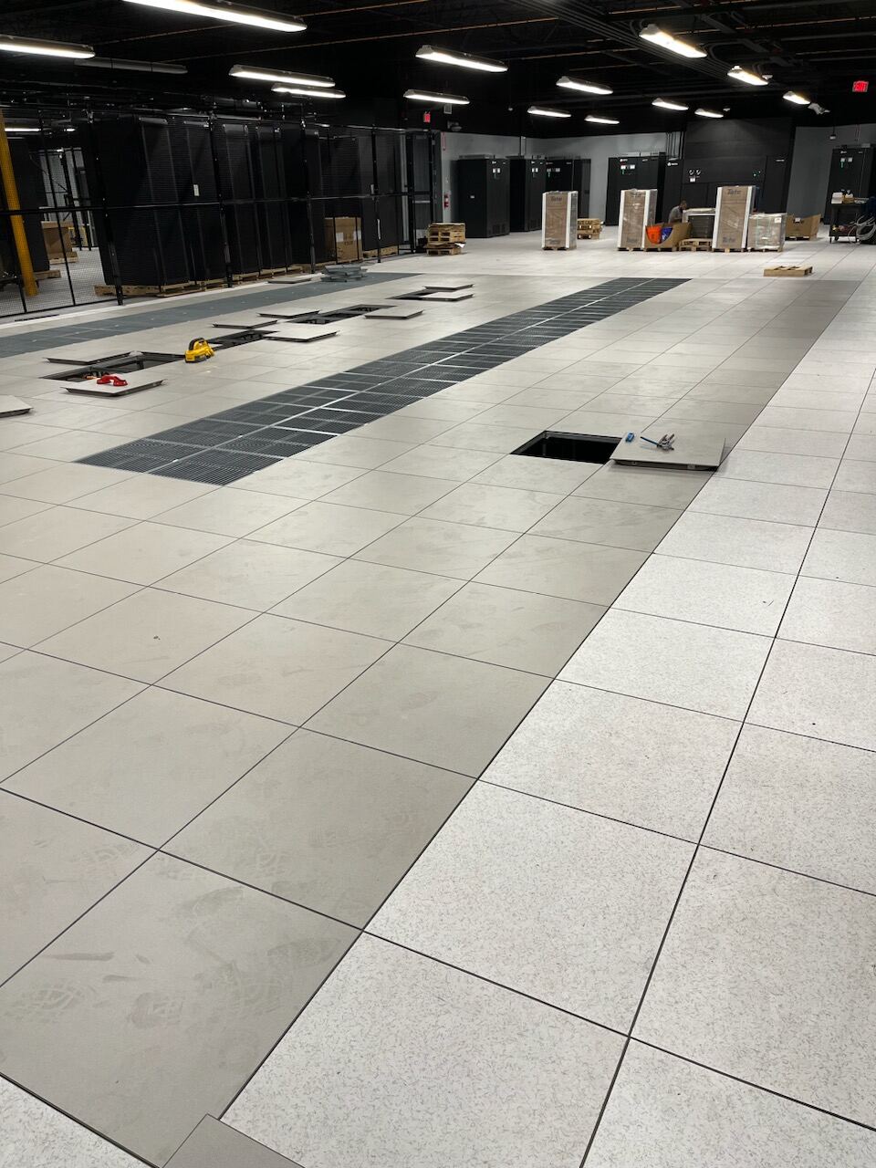 Dynamic Building Systems crew installing a raised access floor